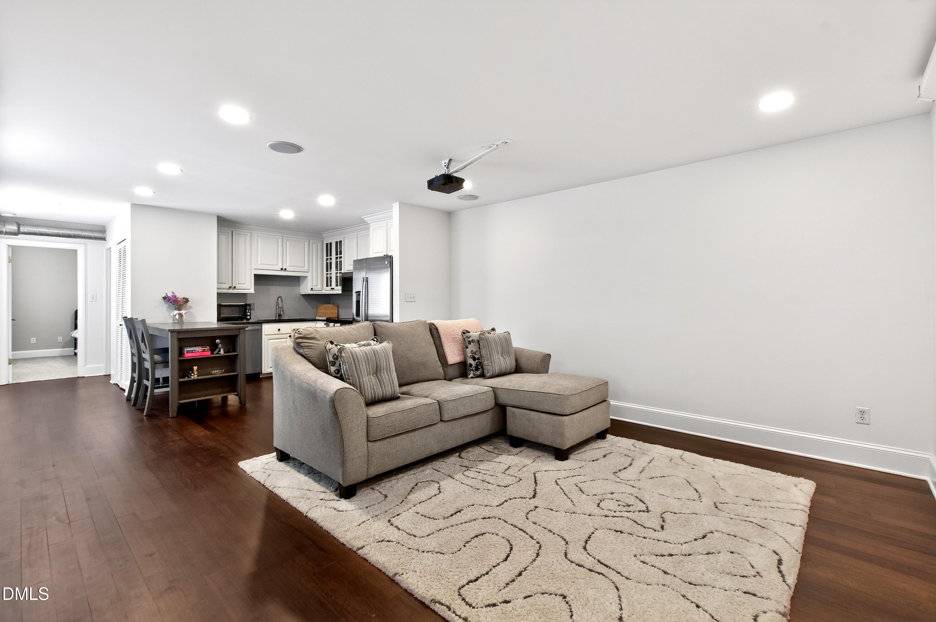 2204 Stafford Avenue, Unit 202 Raleigh, NC 27607 - Photo 6 of 34 a living room with furniture and a wooden floor
