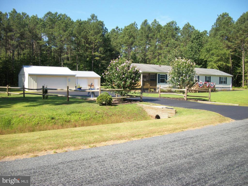 34295-5 5 Bridges Road Princess Anne, MD 21853 - Photo 3 of 26 a view of a house with swimming pool and a yard