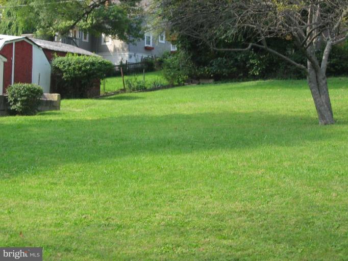 148150 St Albans Road Baltimore, MD 21239 - Photo 1 of 4 a view of a backyard with a garden