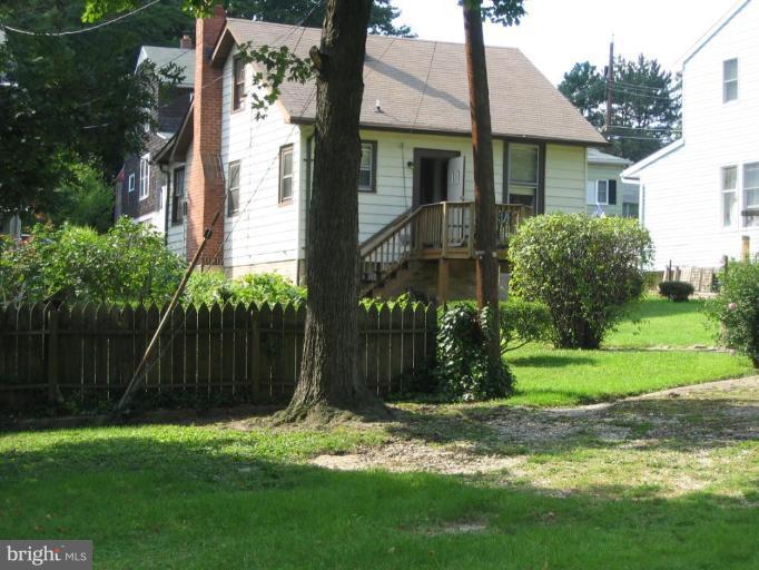 148150 St Albans Road Baltimore, MD 21239 - Photo 2 of 4 a view of a house with a yard and plants