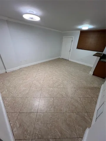a view of a livingroom with an empty space and a sink