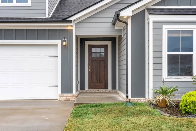 a front view of a house with a yard