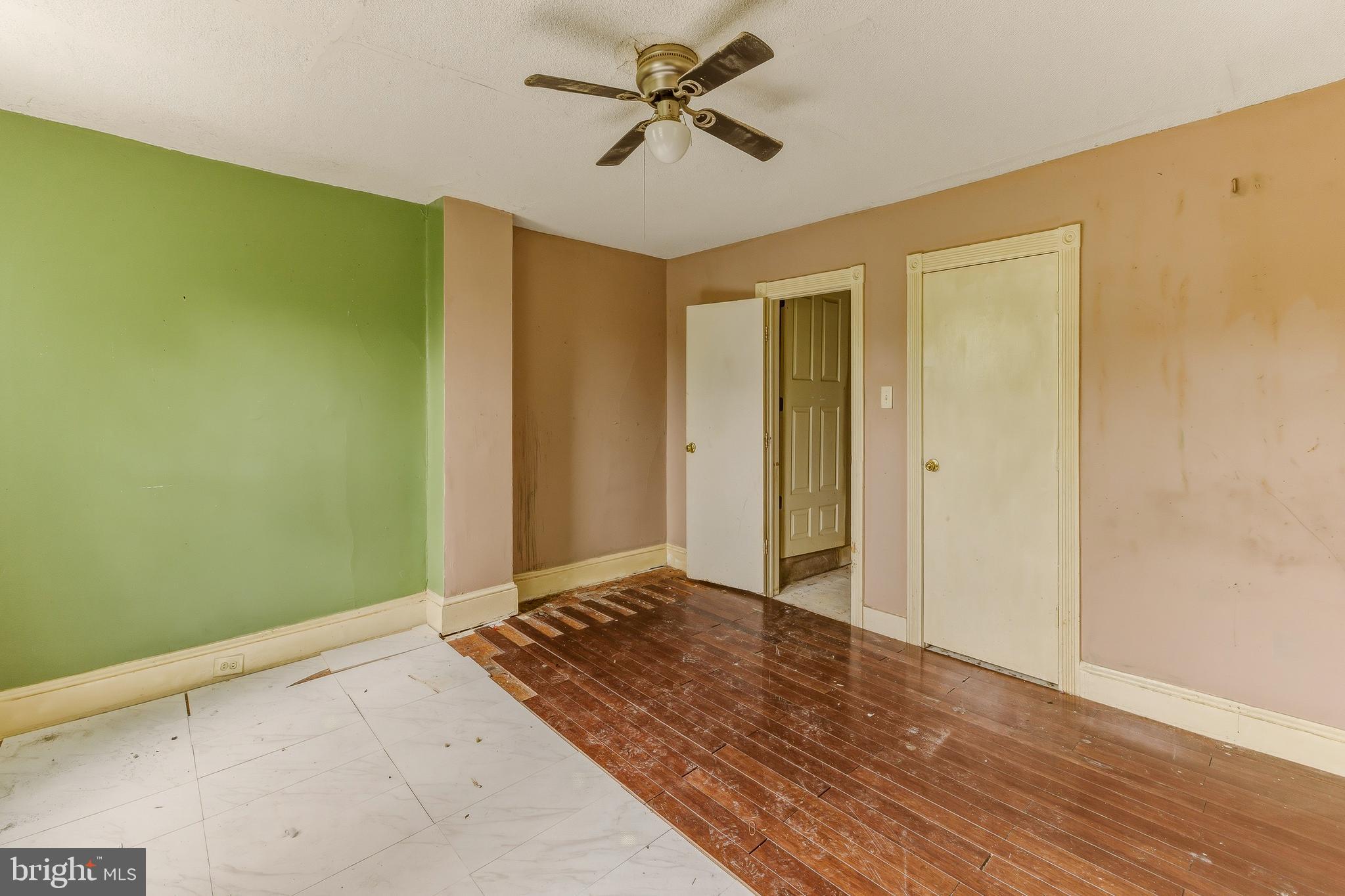 246 Rutland Avenue Mount Holly, NJ 08060 - Photo 11 of 18 a view of a livingroom with a chandelier fan and wooden floor