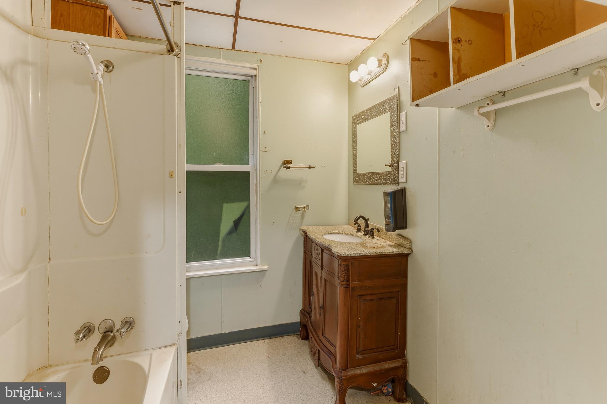 246 Rutland Avenue Mount Holly, NJ 08060 - Photo 13 of 18 a view of a bathroom with a sink and mirror