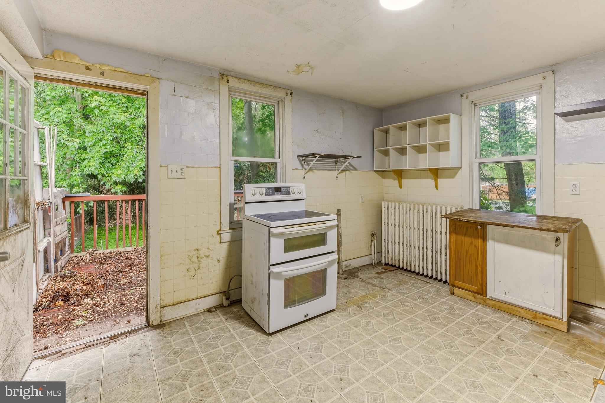 246 Rutland Avenue Mount Holly, NJ 08060 - Photo 8 of 18 a kitchen with a stove top oven and a refrigerator