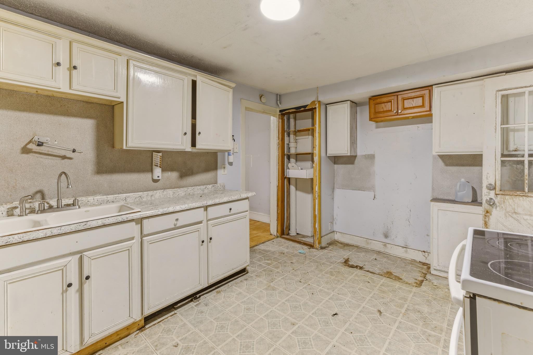 246 Rutland Avenue Mount Holly, NJ 08060 - Photo 9 of 18 a spacious bathroom with a sink and a mirror