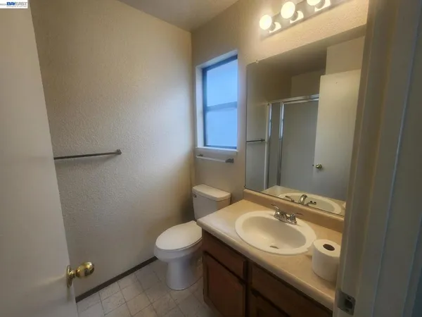 a bathroom with a glass shower door