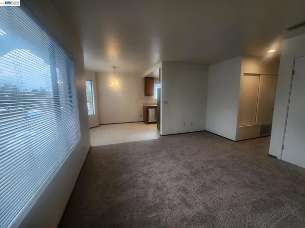 a view of a hallway with staircase