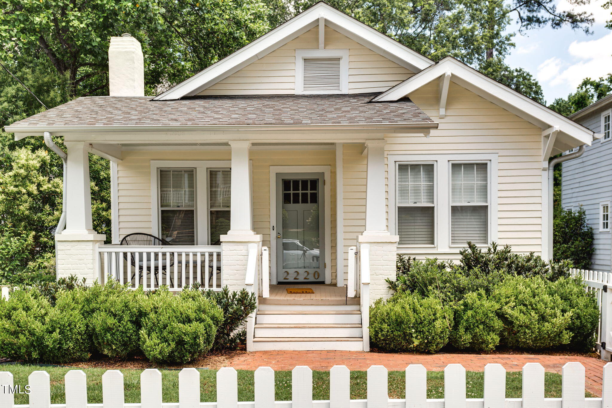 2220 Creston Road Raleigh, NC 27608 - Photo 1 of 36 a front view of a house with a porch