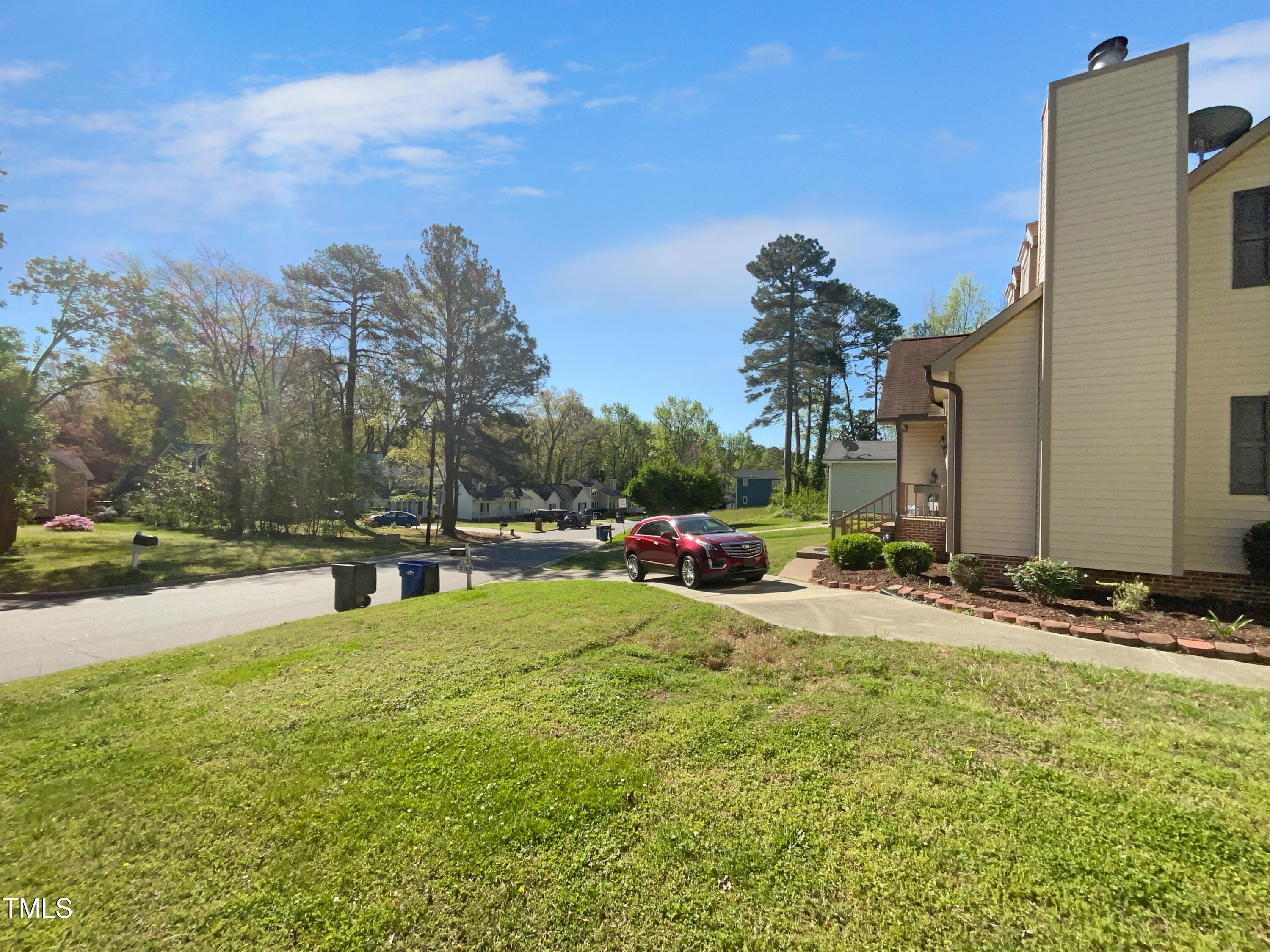 720 Rawls Drive Raleigh, NC 27610 - Photo 17 of 17 a view of a street with a building and a big yard