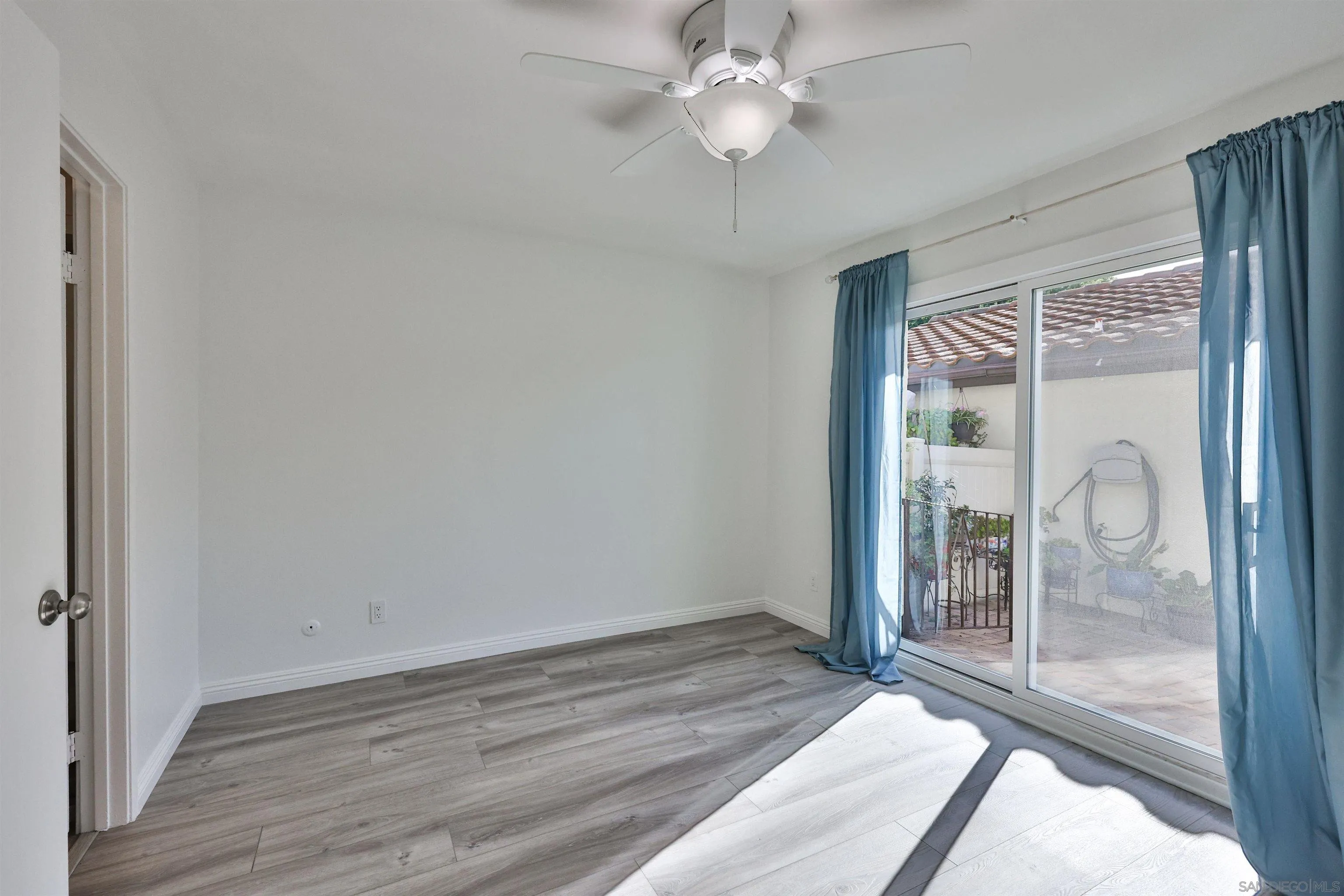 1732 Belle Meade Road Encinitas, CA 92024 - Photo 12 of 37 a view of a room with wooden floor and fan