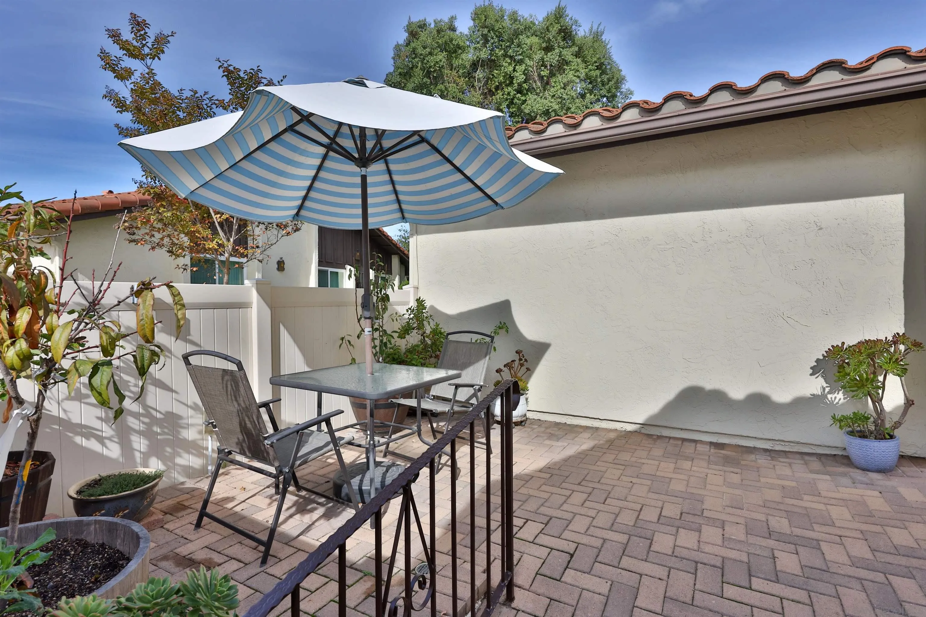 1732 Belle Meade Road Encinitas, CA 92024 - Photo 17 of 37 a patio with a table and chairs