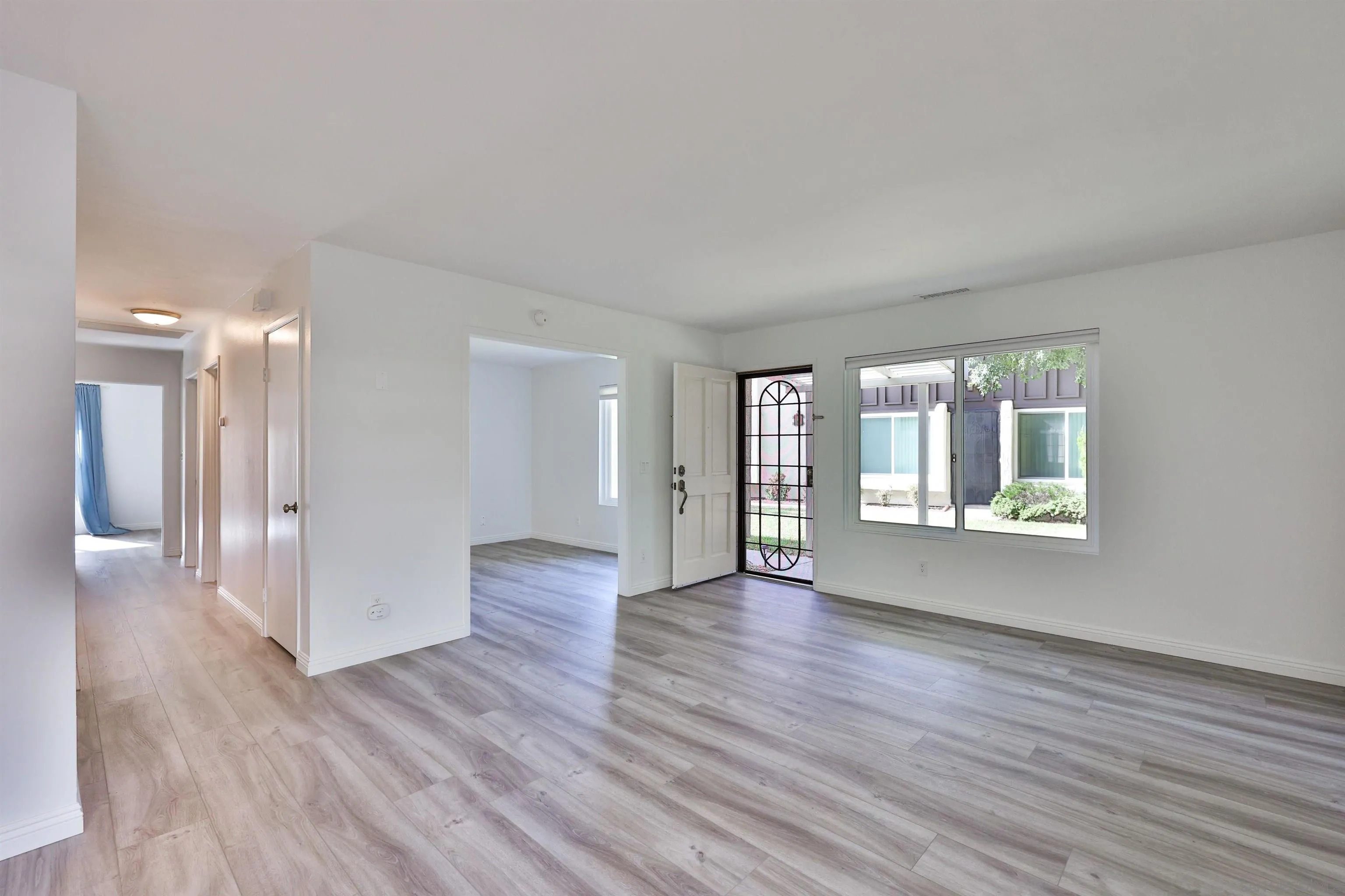1732 Belle Meade Road Encinitas, CA 92024 - Photo 6 of 37 a view of an empty room with wooden floor and a window