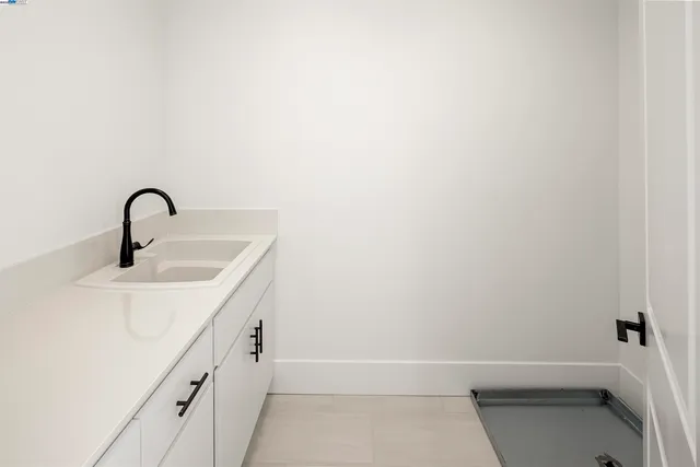 a bathroom with a sink and mirror