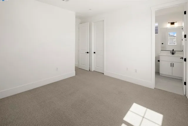 an empty room with a bathroom