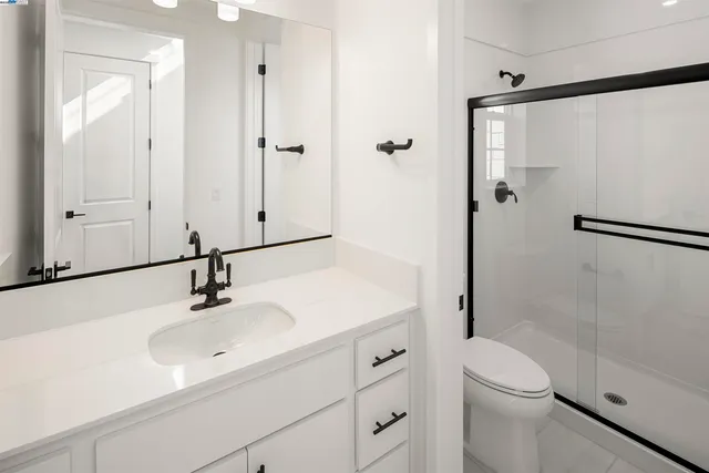 an empty room with entrance and windows