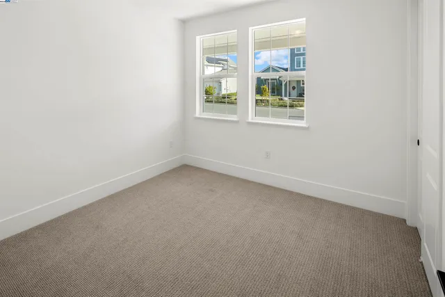 a view of a balcony with wooden floor