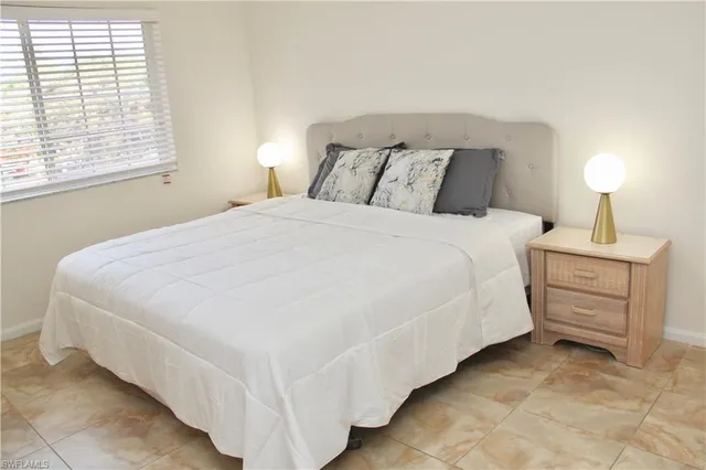 a bedroom with a bed and dresser