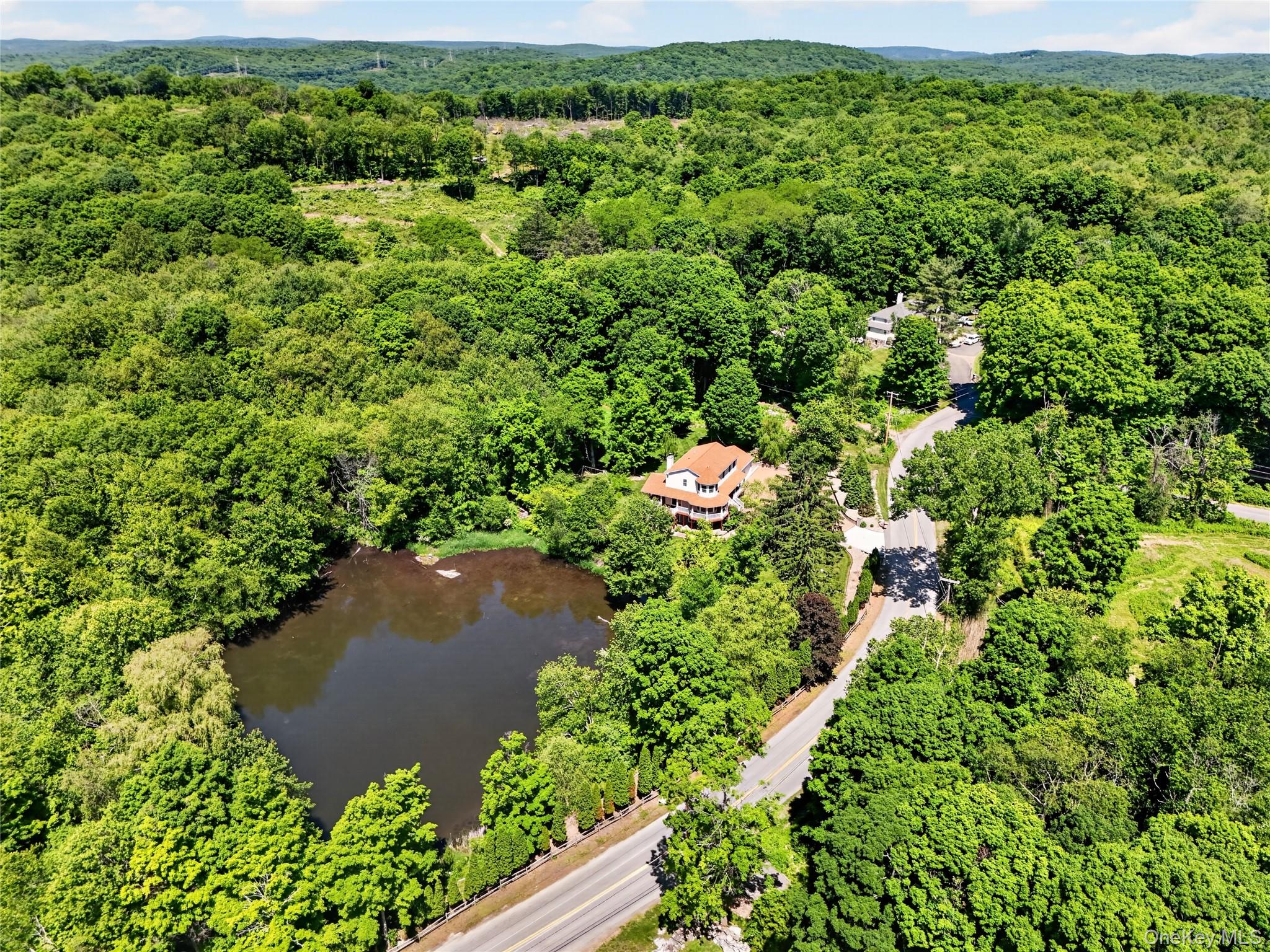433 Barrett Hill Road Mahopac, NY 10541 - Photo 1 of 39 an aerial view of residential house with outdoor space and trees all around
