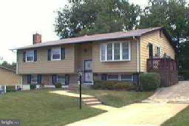 4553 Kinmount Road Lanham, MD 20706 - Photo 1 of 1 a front view of a house with garden