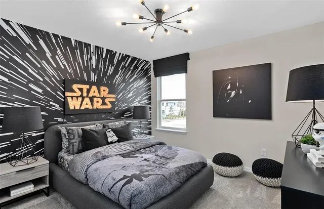 a bedroom with a bed and a ceiling fan