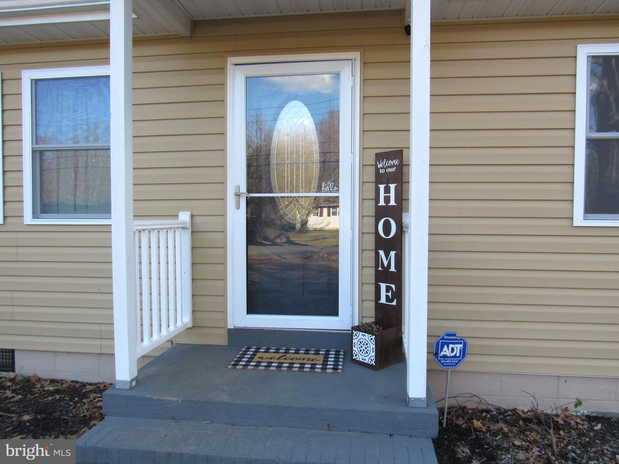1165 Steamboat Road Shady Side, MD 20764 - Photo 4 of 51 Front entrance with storm door