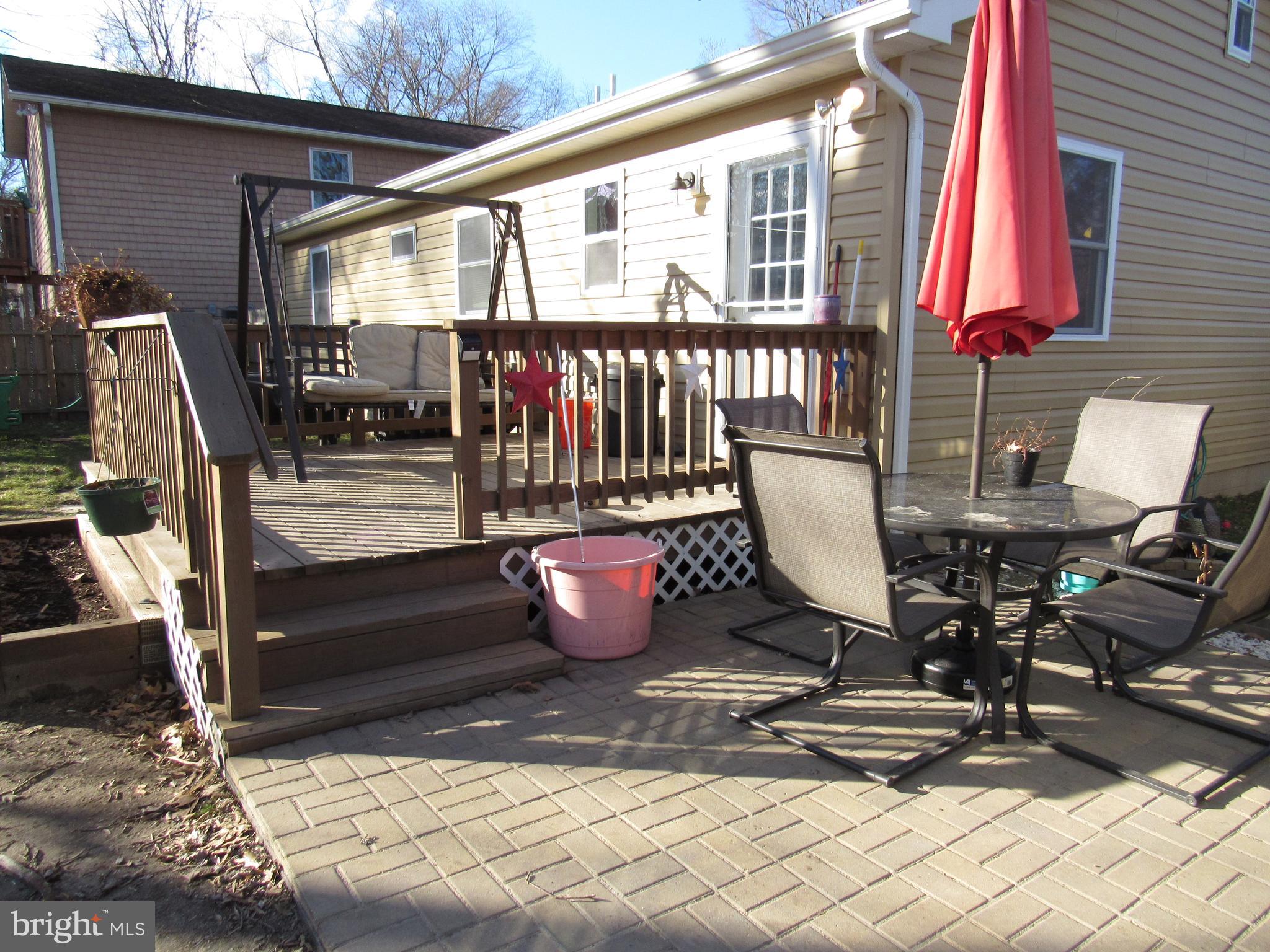 1165 Steamboat Road Shady Side, MD 20764 - Photo 8 of 51 Back yard paver patio and deck