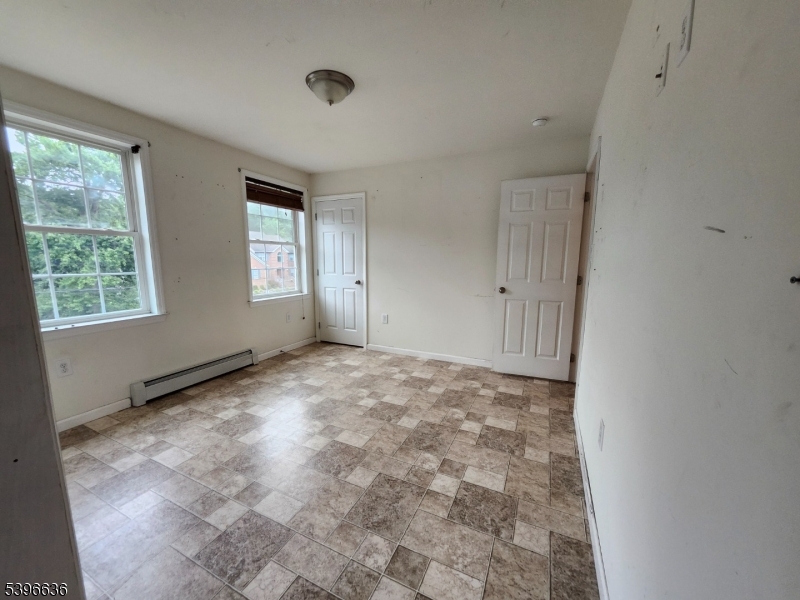 128 Big Piece Road Fairfield, NJ 07004 - Photo 9 of 22 a view of an empty room with a window