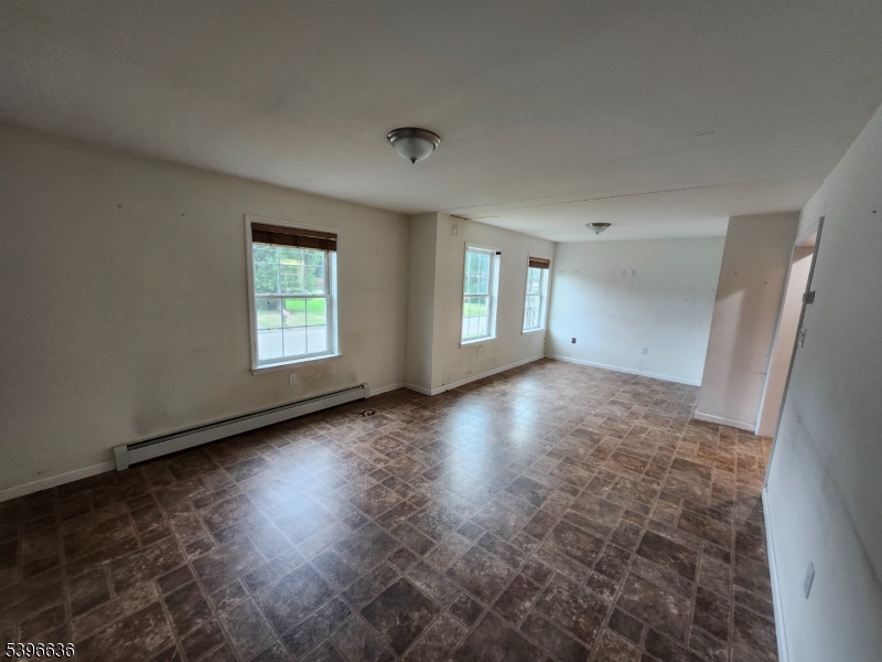 128 Big Piece Road Fairfield, NJ 07004 - Photo 10 of 22 an empty room with windows