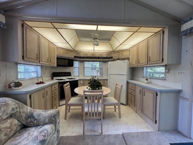 2795 East 28th Road Marseilles, IL 61341 - Photo 11 of 59 a kitchen with a sink and cabinets