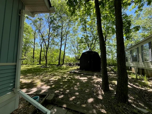 a backyard of a house with lots of green space