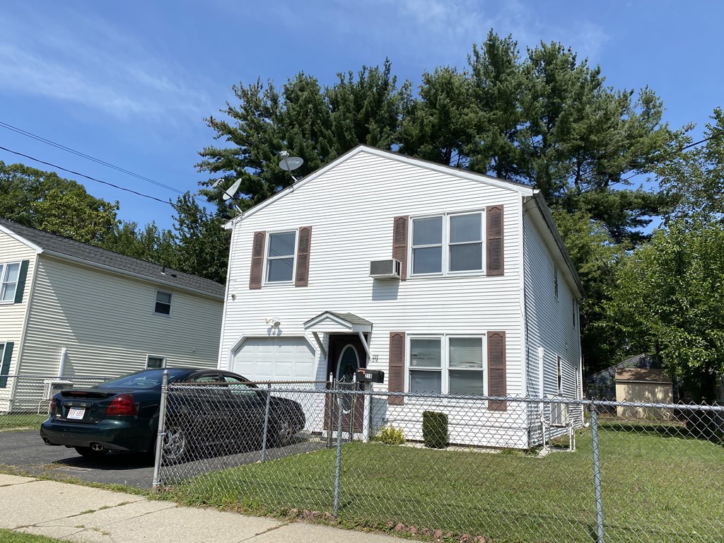 218-220 Centre Street Springfield, MA 01151 - Photo 1 of 27 a front view of a house with a garden