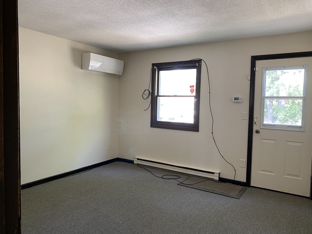 218-220 Centre Street Springfield, MA 01151 - Photo 11 of 27 an empty room with a window
