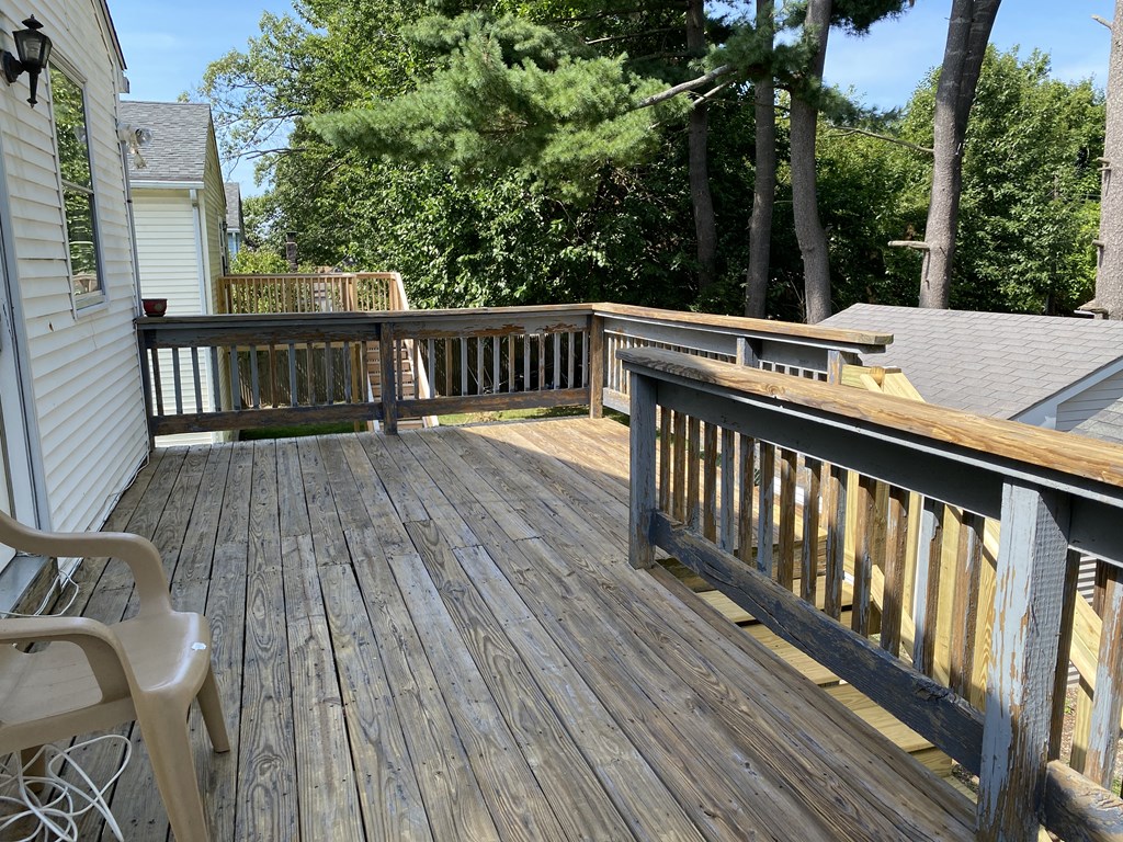 218-220 Centre Street Springfield, MA 01151 - Photo 10 of 27 a view of balcony with wooden floor and fence