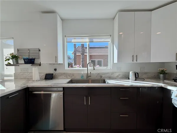 a view of a livingroom with furniture and staircase