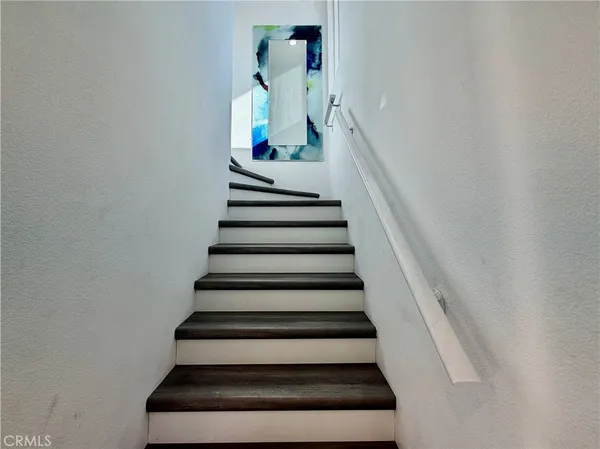 a view of a kitchen from the hallway