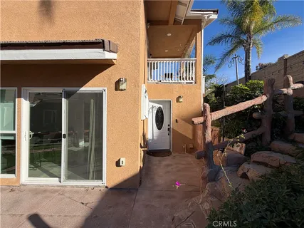 a view of a street with potted plants