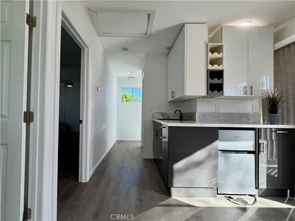 a living room with a bed furniture and a window