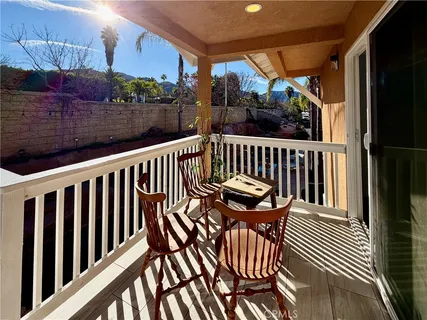 a backyard of a house with outdoor seating