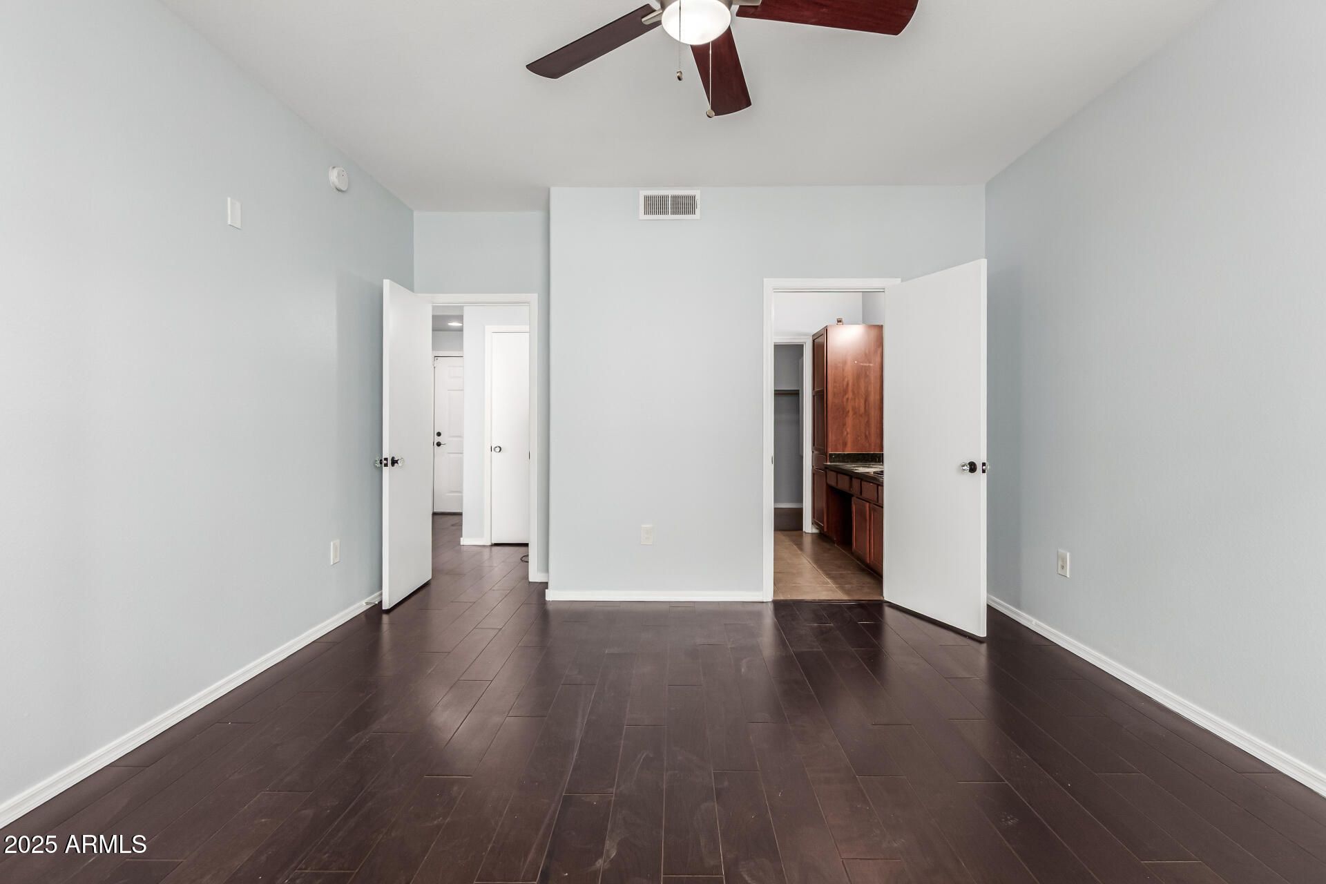 3302 North 7th Street, Unit 225 Phoenix, AZ 85014 - Photo 10 of 23 a view of an empty room with wooden floor