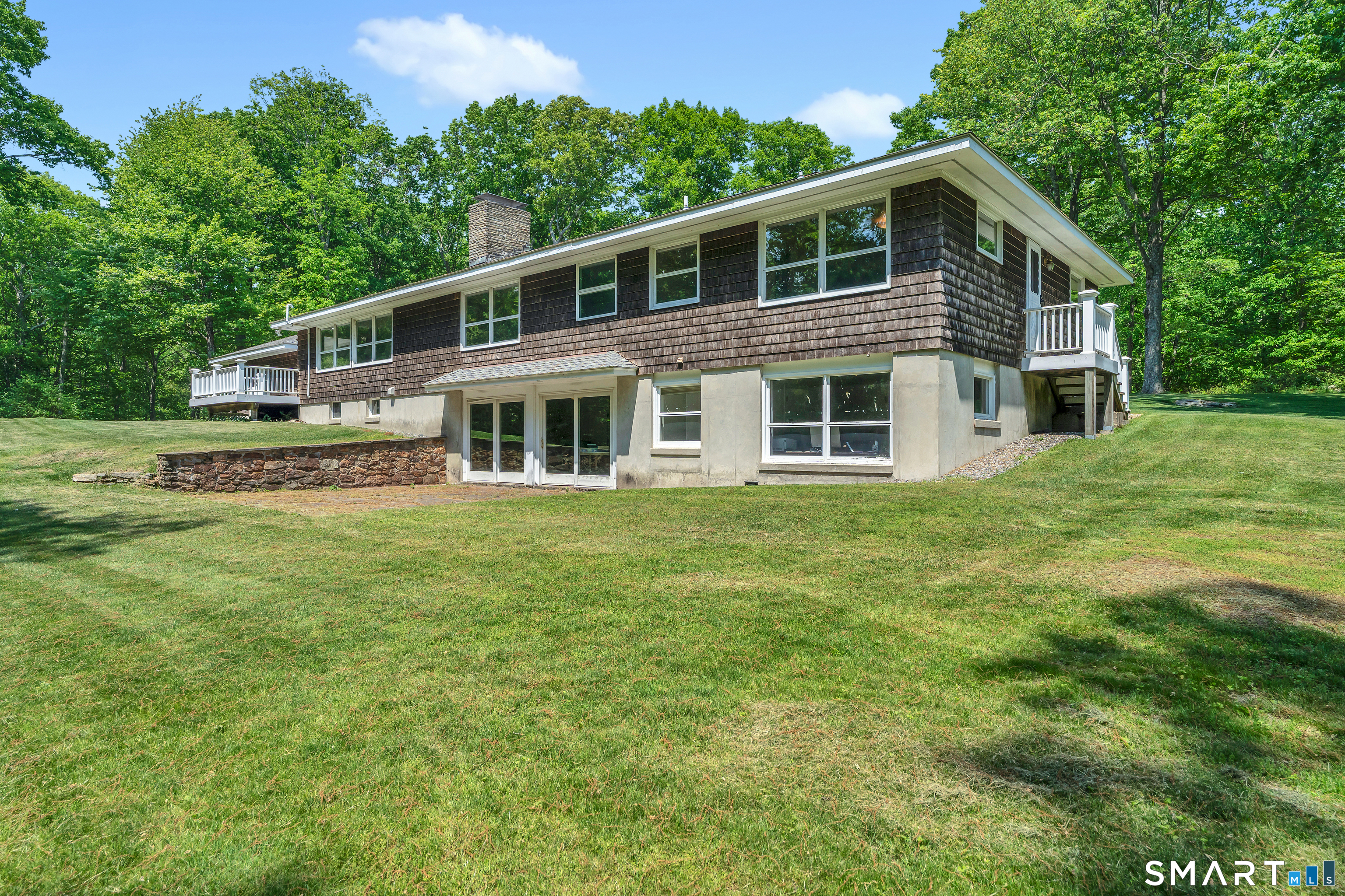 30 Maltbie Road Newtown, CT 06470 - Photo 7 of 40 a front view of a house with a garden