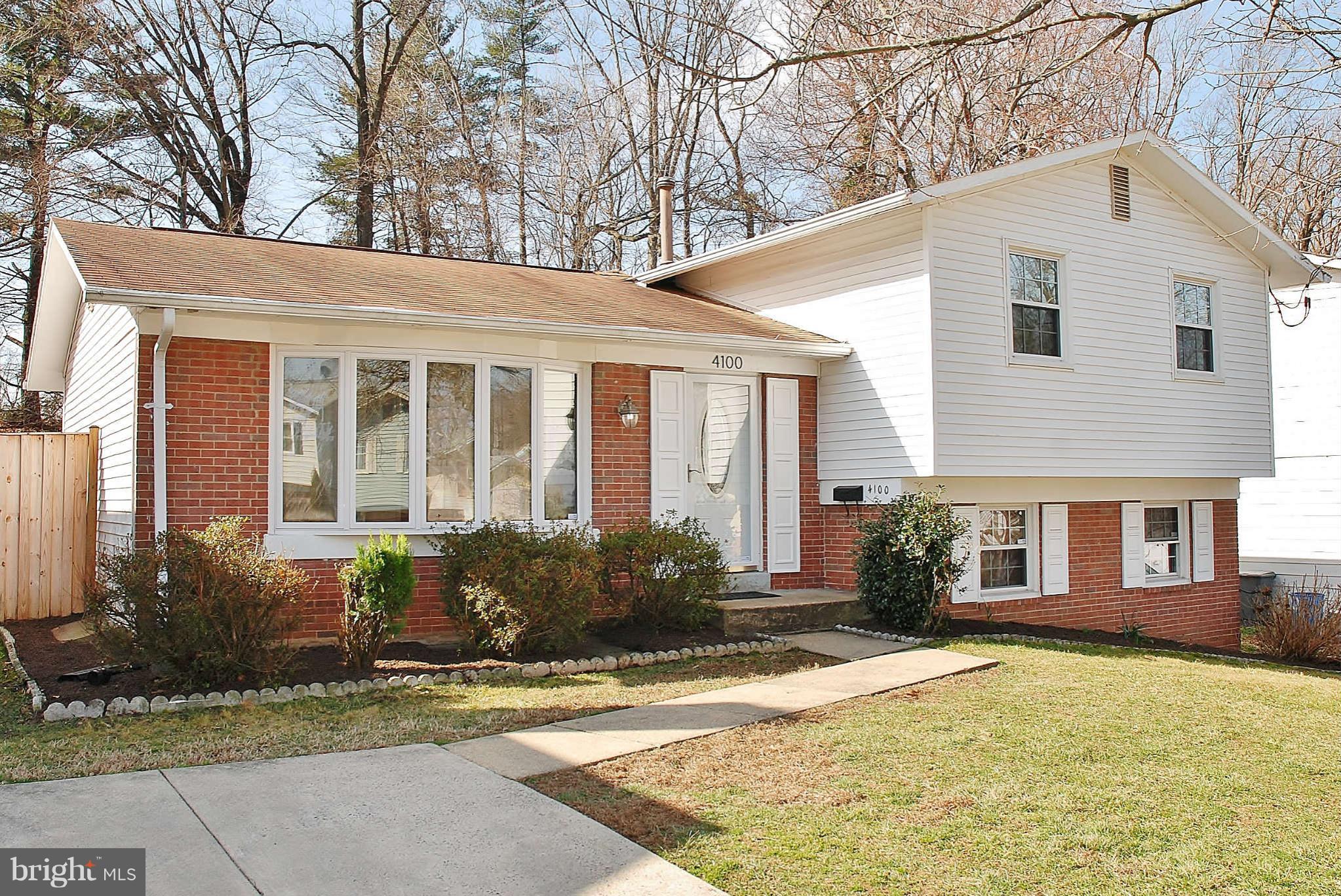 4100 Delancy Drive Silver Spring, MD 20906 - Photo 1 of 20 a front view of a house with garden
