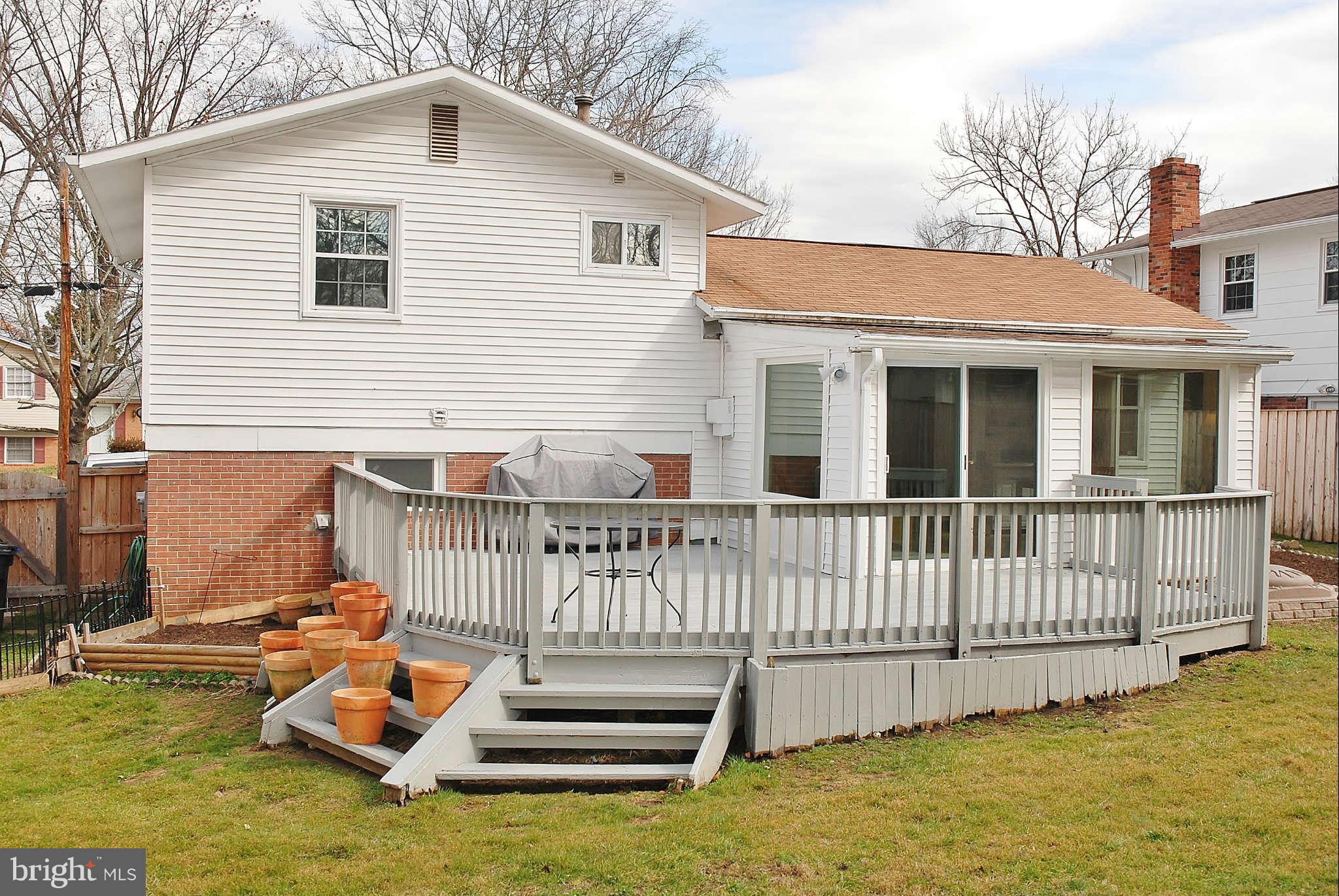 4100 Delancy Drive Silver Spring, MD 20906 - Photo 14 of 20 a view of a house with a wooden deck