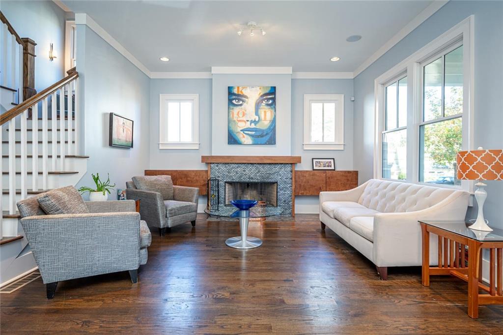 123 Ansley Street Decatur, GA 30030 - Photo 7 of 61 a living room with furniture and a fireplace