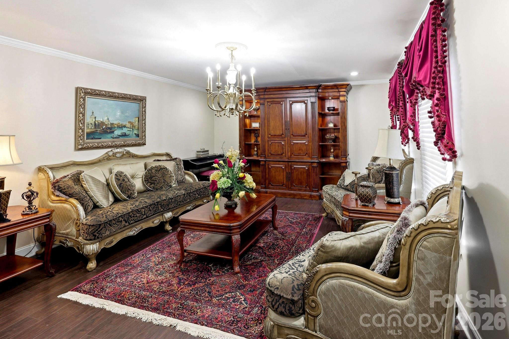 327 Sherry Street Rutherfordton, NC 28139 - Photo 3 of 22 a living room with furniture a rug and a chandelier