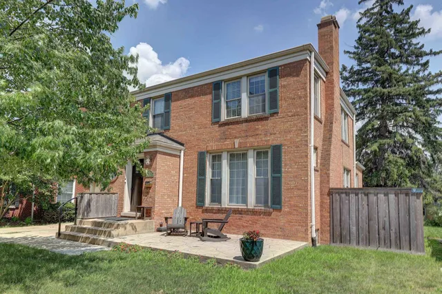 a front view of a house with a garden
