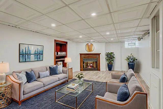 a living room with furniture and a fireplace