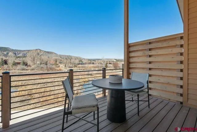 a view of a chairs and table on the terrace