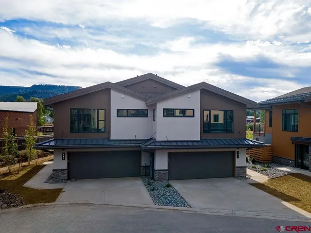 a view of house with swimming pool in front of it