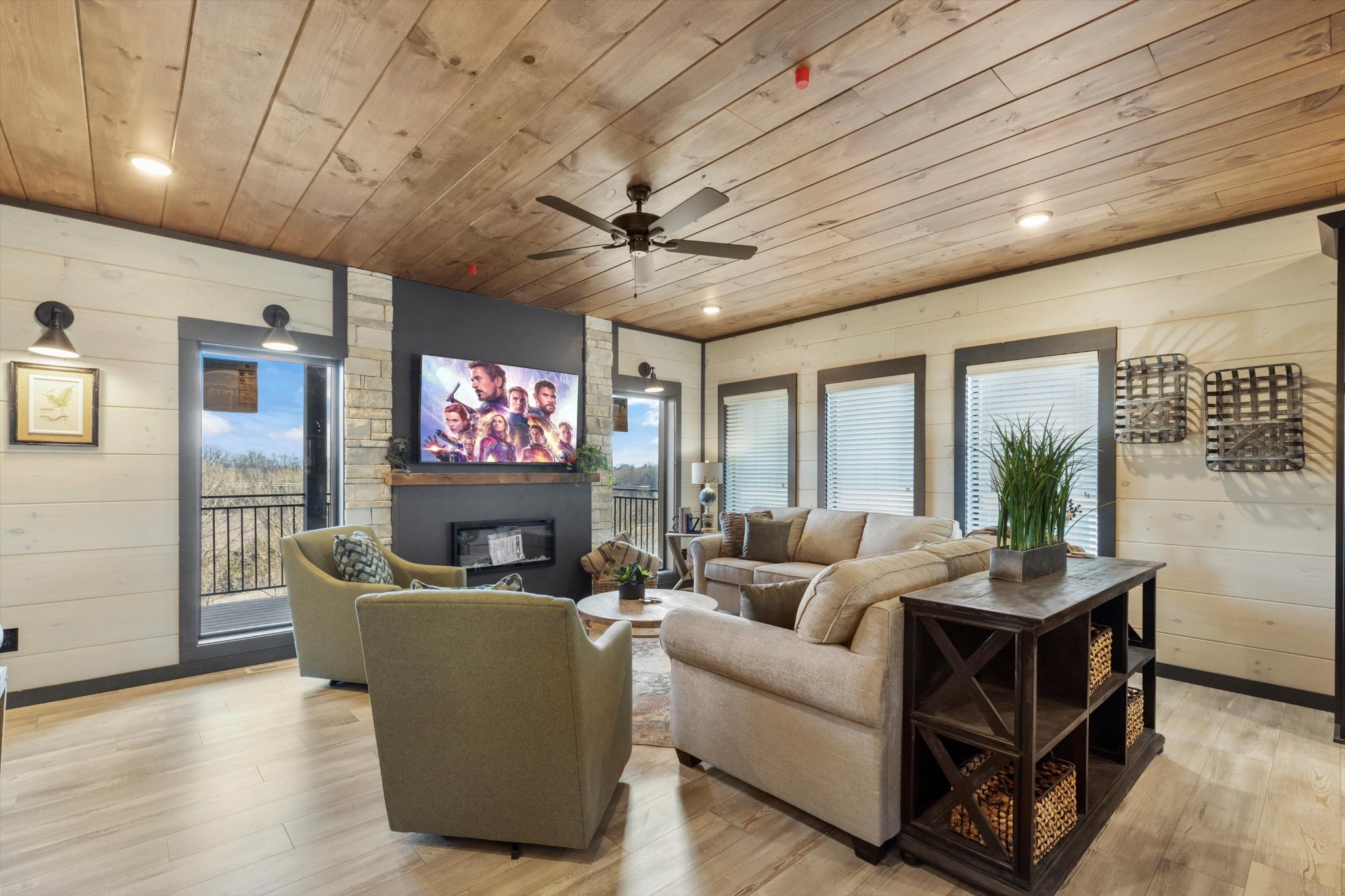 320 Rambling Creek Way Sevierville, TN 37862 - Photo 26 of 65 a living room with furniture a ceiling fan and a flat screen tv